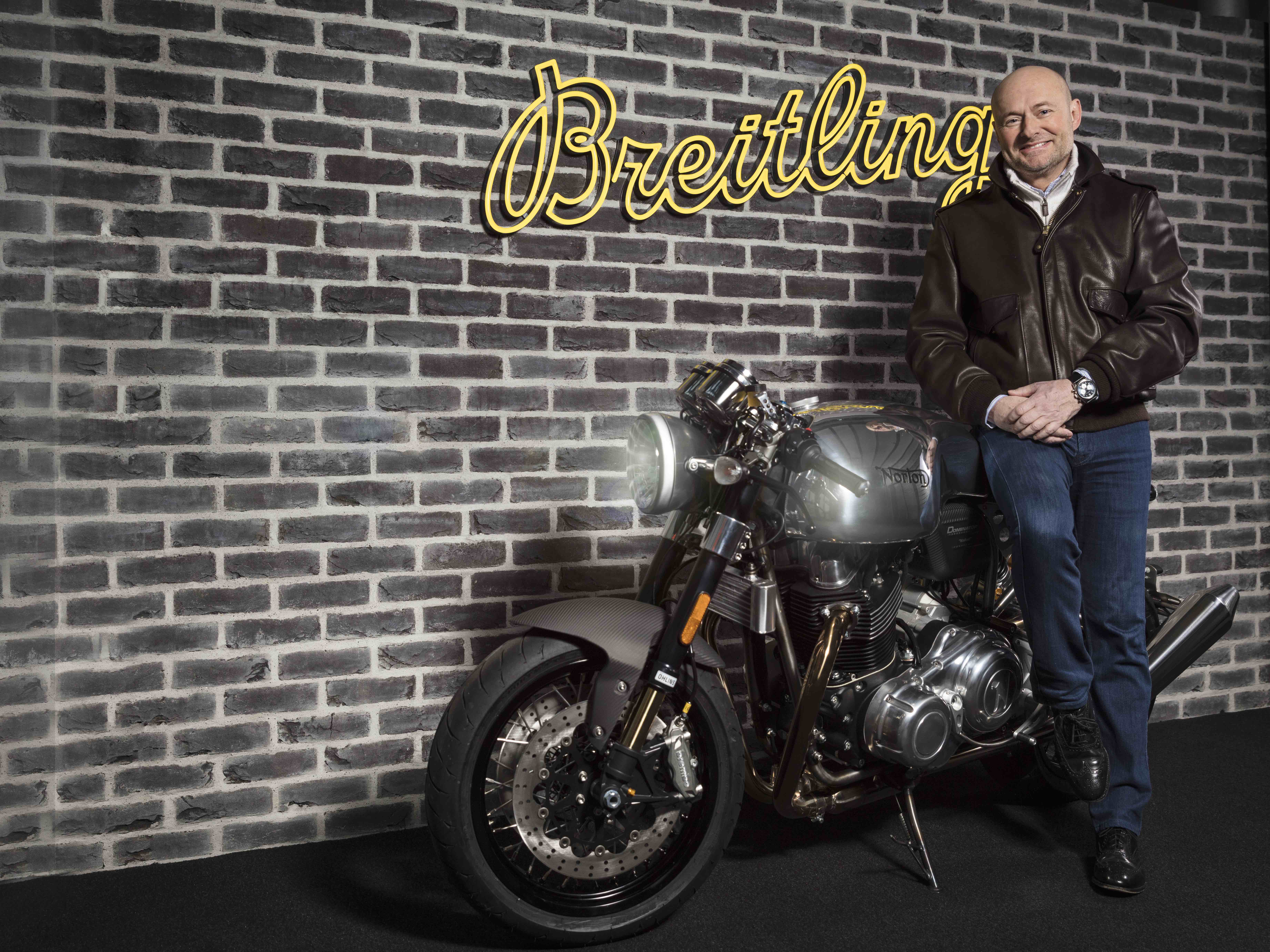 Breitling CEO, Mr. Georges Kern and a Norton Dominator Motorcycle. (PPR/Breitling)